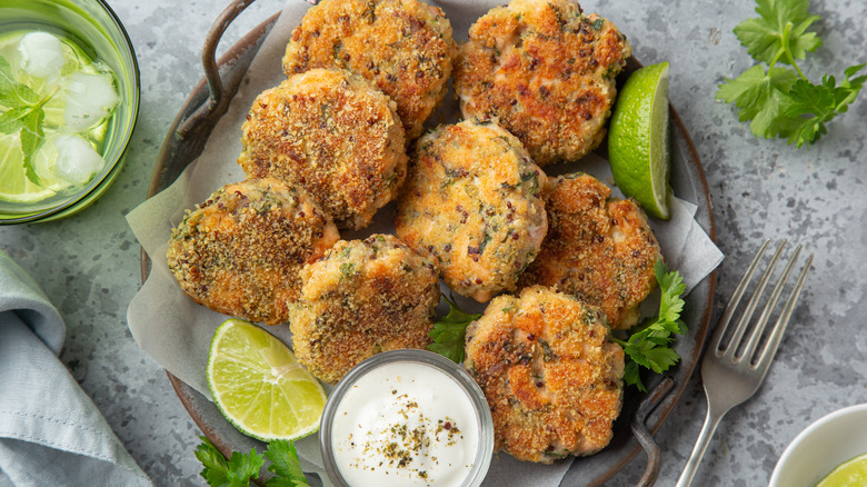 salmon patties on plate with creamy dip