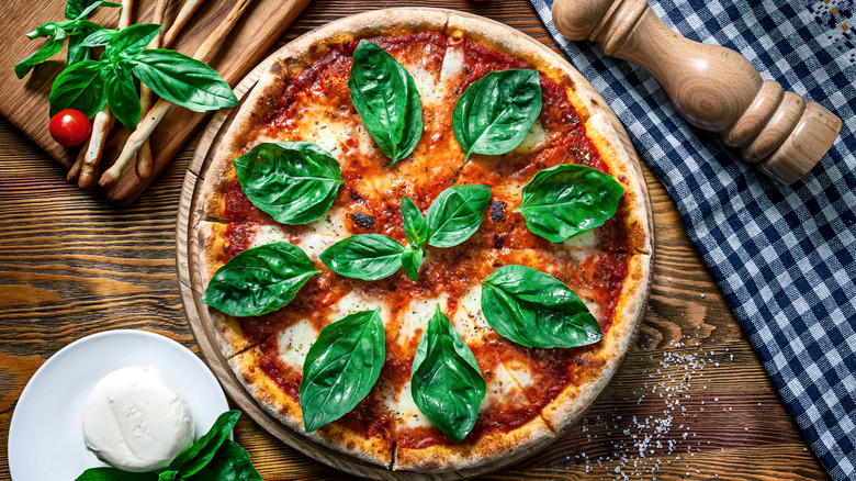 fresh basil leaves on pizza