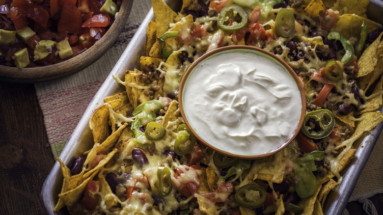 nachos with condiments