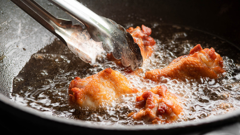 frying chicken on stove