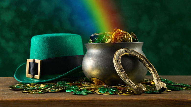 Green hat, pot of gold, horseshoe, and rainbow