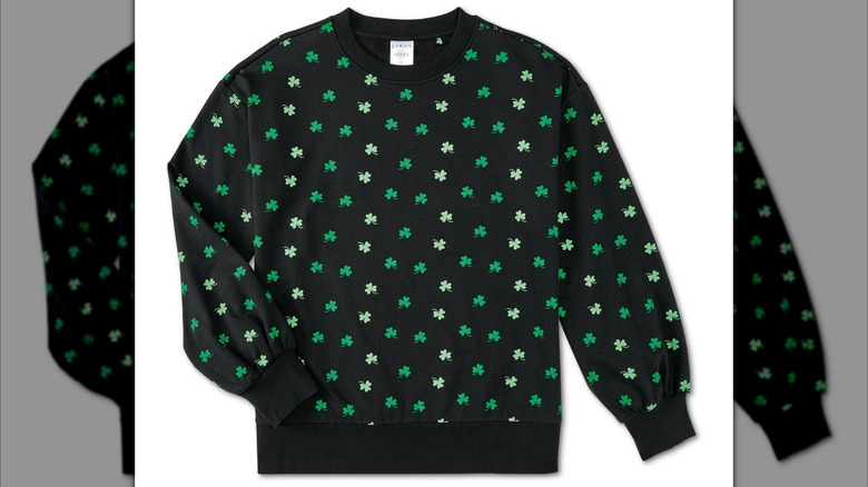 Black pullover sweater with dark and light green shamrock print