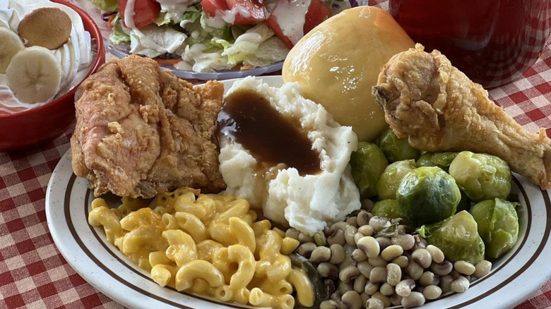 Plates of Southern food on checkered cloth