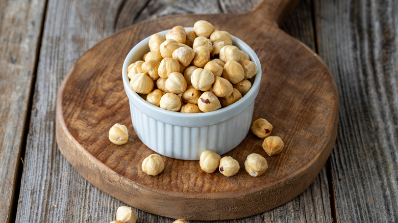 Peeled hazelnuts on a wooden board