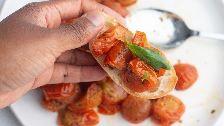 air fried cherry tomatoes on piece of toast