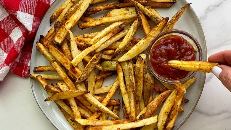 plate of french fries with ketchup