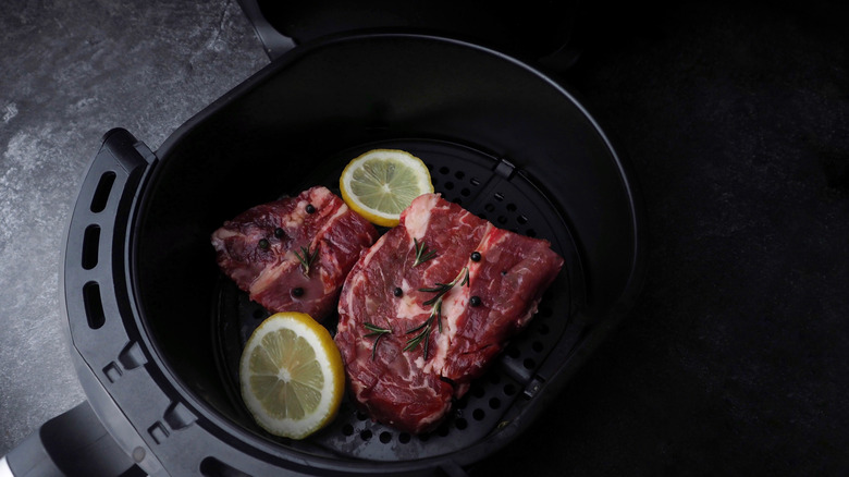 Steaks in air fryer basket