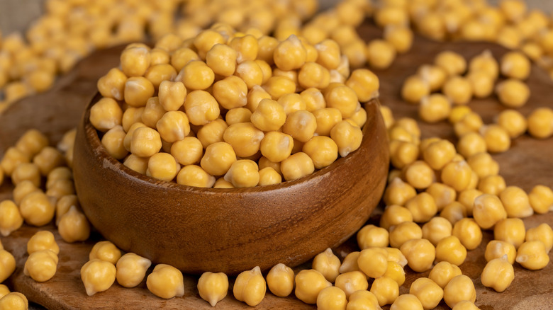 chickpeas overflowing from wooden bowl