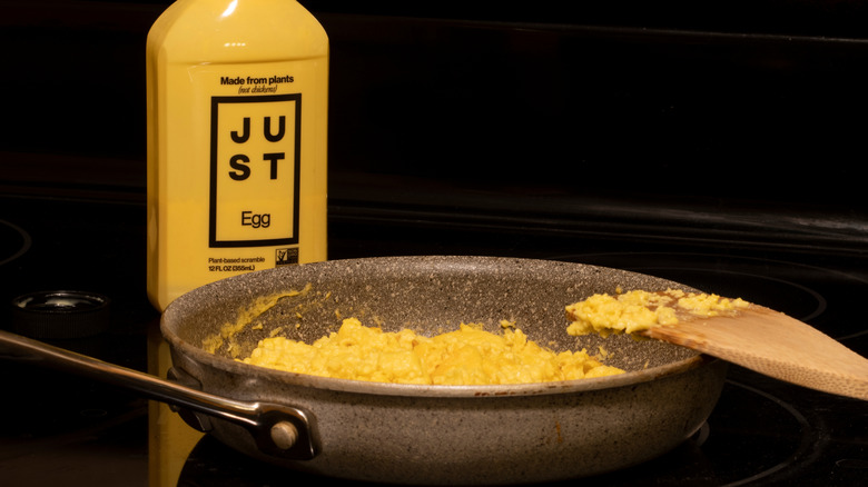 bottle of Just Egg next to pan of it scrambled