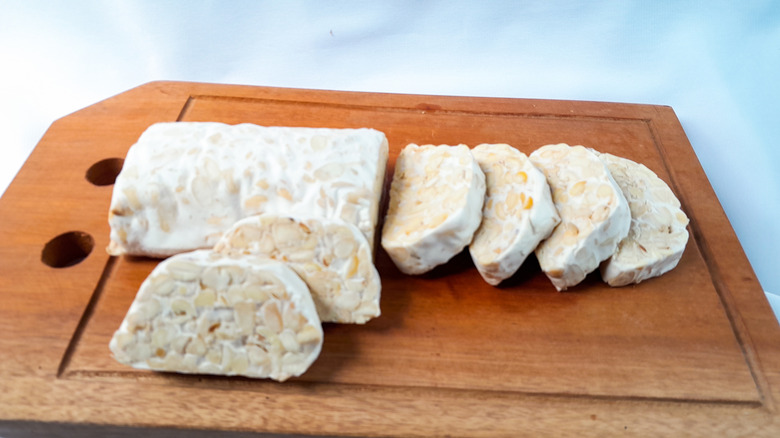 tempeh on wooden cutting board