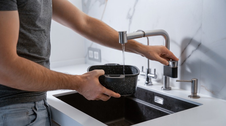 pouring water in a pot