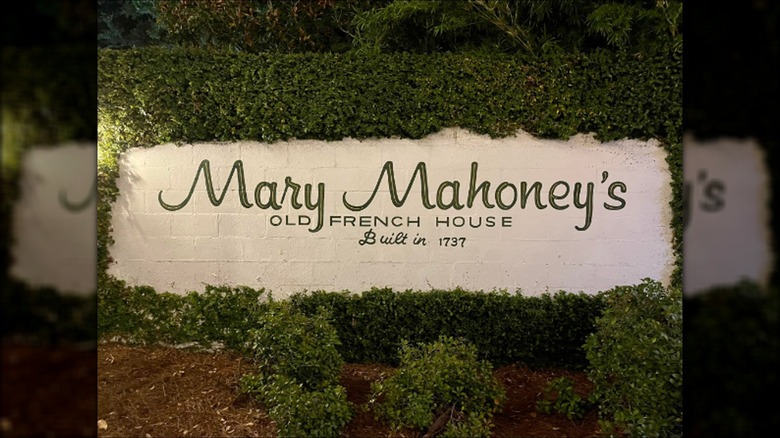 Mary Mahoney's Old French House sign on ivy