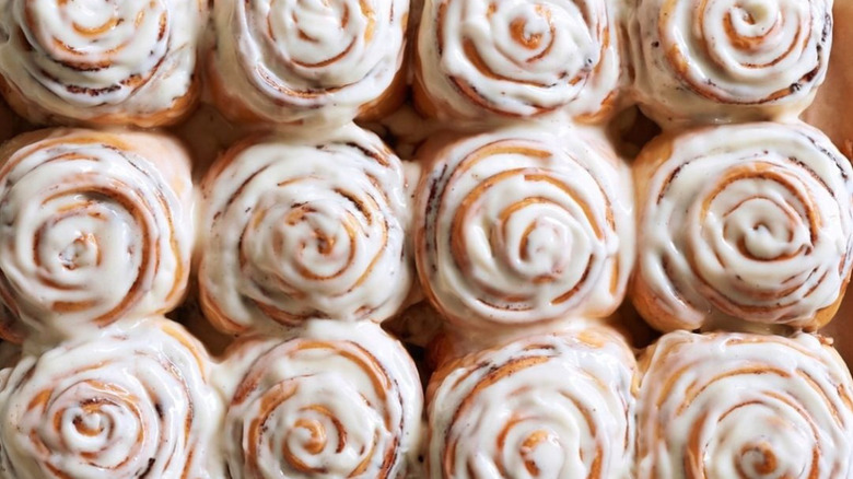 Rows of iced cinnamon buns