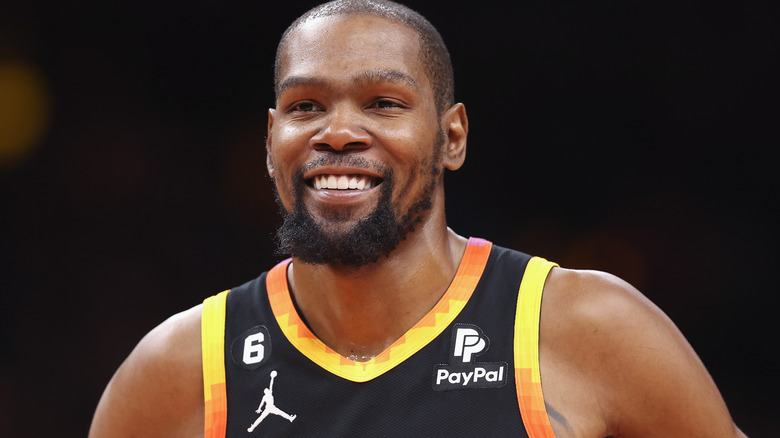 Kevin Durant smiling in basketball jersey