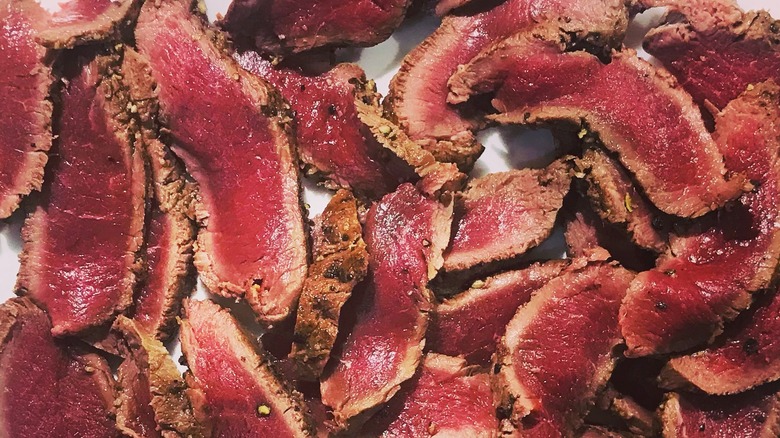 Thinly sliced venison on a plate