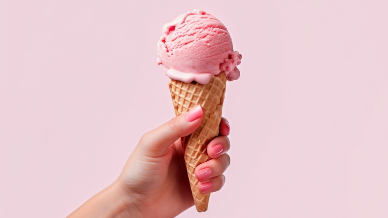 Holding pink ice cream cone