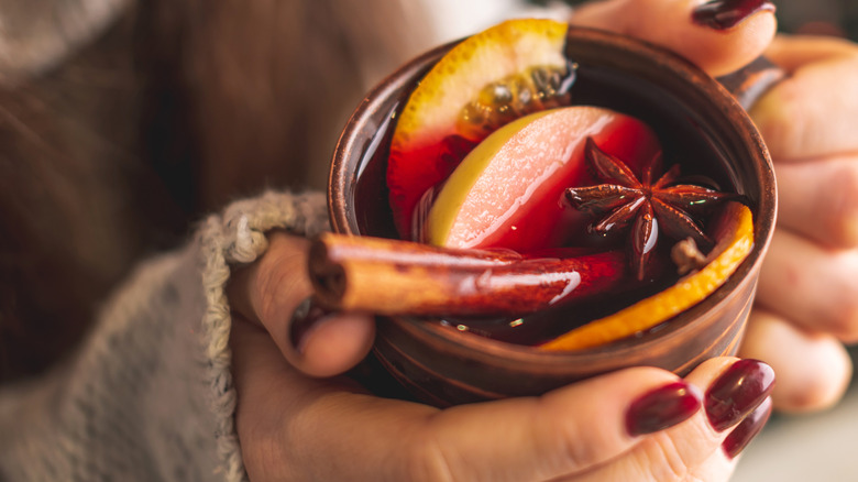 woman holding mulled wine