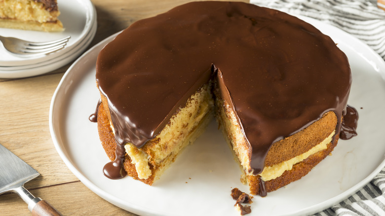 Boston cream pie on white plate