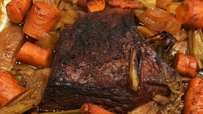 Pot roast surrounded by veggies