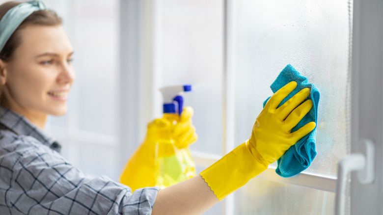 woman cleaning windows