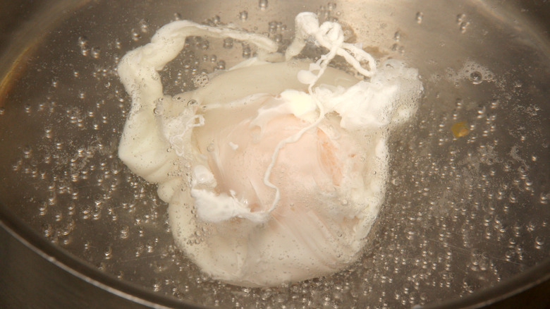 poaching egg in water