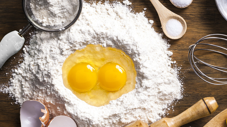 Pile of flour with eggs