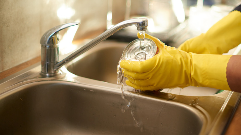 Woman washing can top