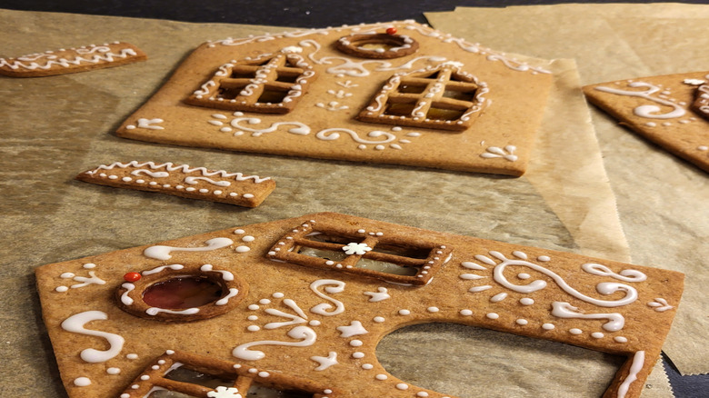 Pieces of gingerbread house decorated before assembly