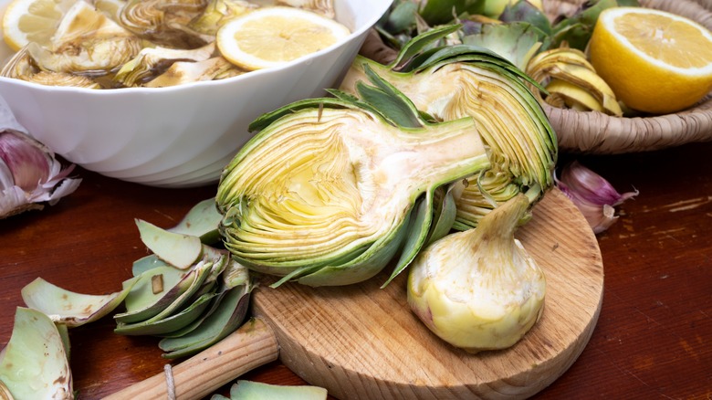 cut artichoke on cutting board