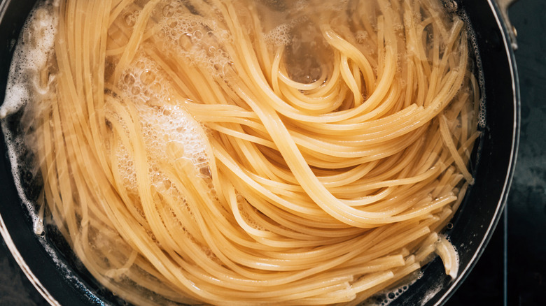 Plain spaghetti cooking in a pot