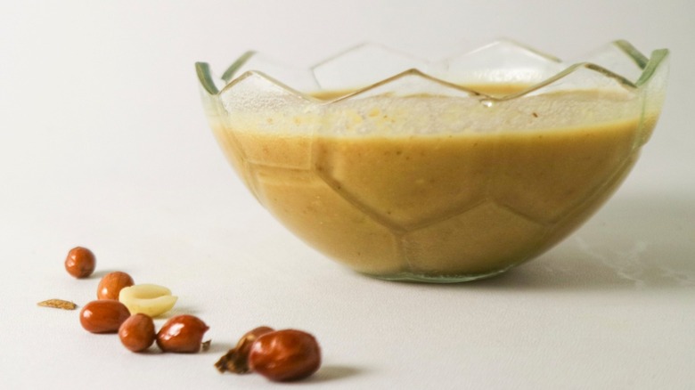 Glass dish filled with peanut sauce