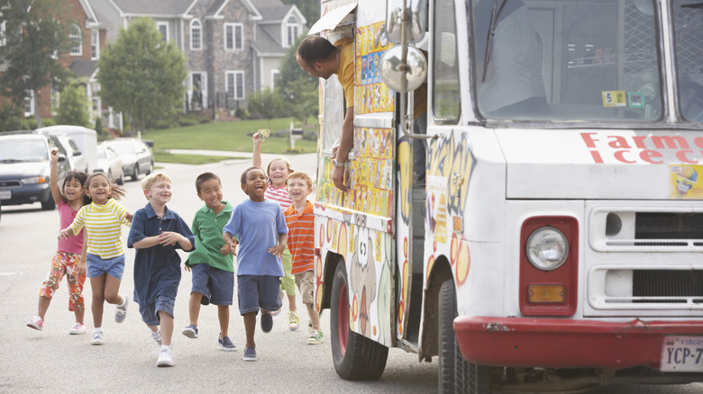 ice cream truck with hungry crowd