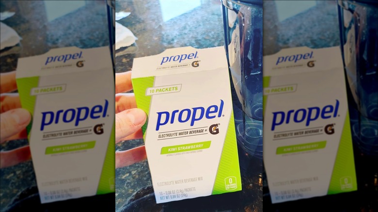 Person holding box of Propel hydration mix