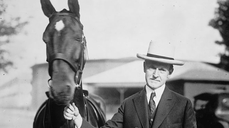 President Calvin Coolidge poses with horse