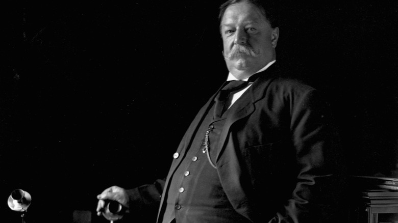 President William Taft poses with telephone