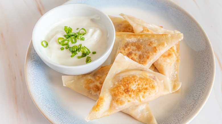 Pierogi with sour cream