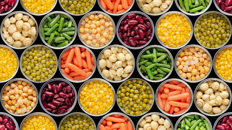 open cans of different vegetables