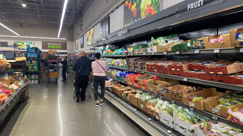 Shoppers in Aldi produce aisle