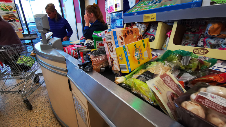 Shopper at Aldi checkout