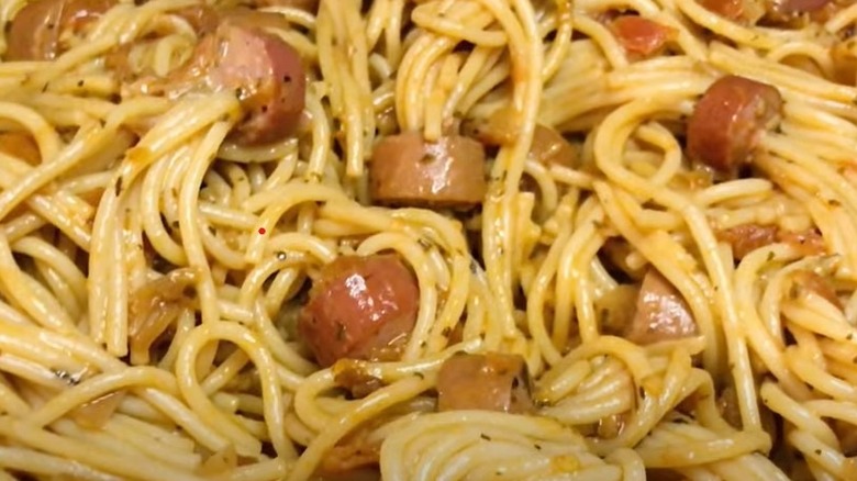Sauages threaded with spaghetti