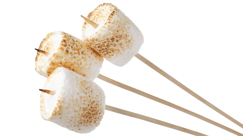 Roasted marshmallows on wooden skewers