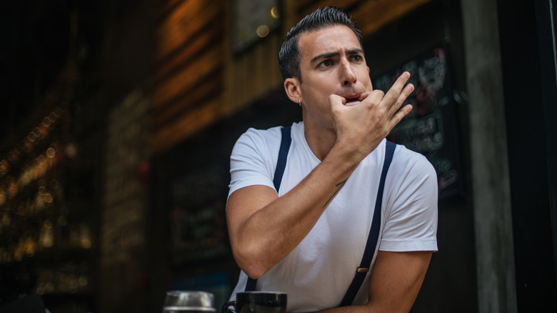 man whistling with fingers