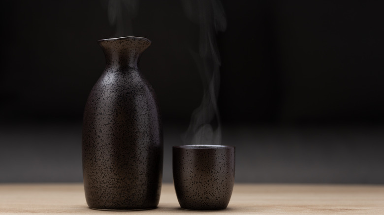 warm sake in ceramic cup 