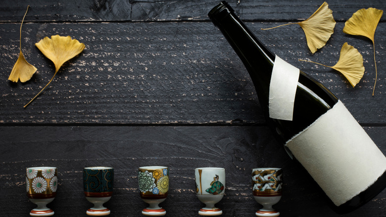 bottle of sake and glasses