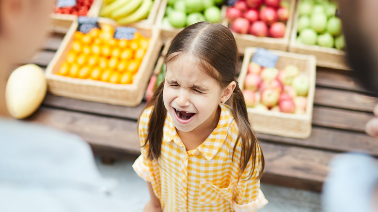 Little girl crying in store