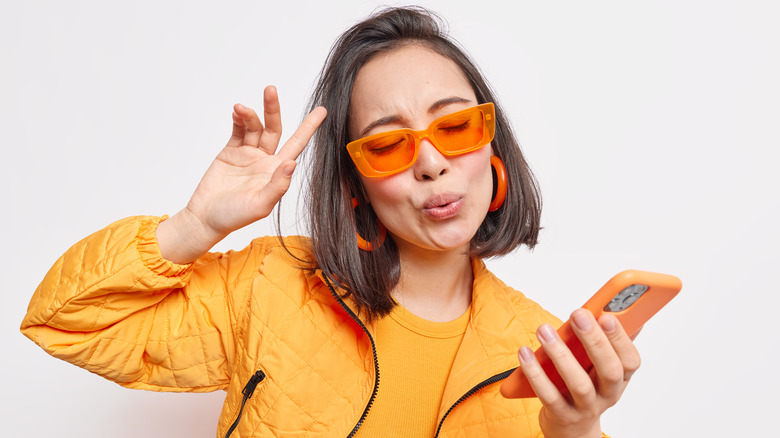 Woman listening to phone music 