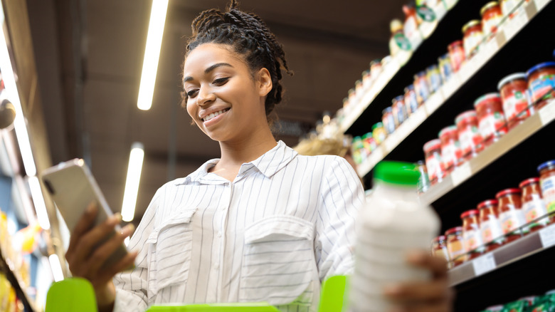 Woman on phone in store