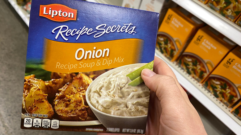 holding lipton onion soup mix