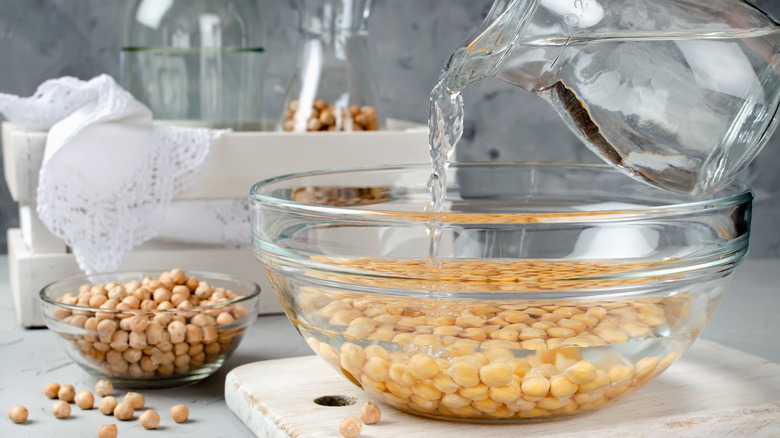 chickpeas soaking in bowl of water