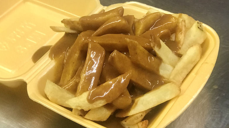 Fries and curry sauce in a container